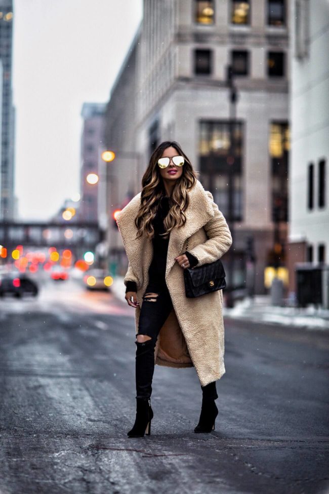 fashion blogger mia mia mine wearing a teddy bear coat