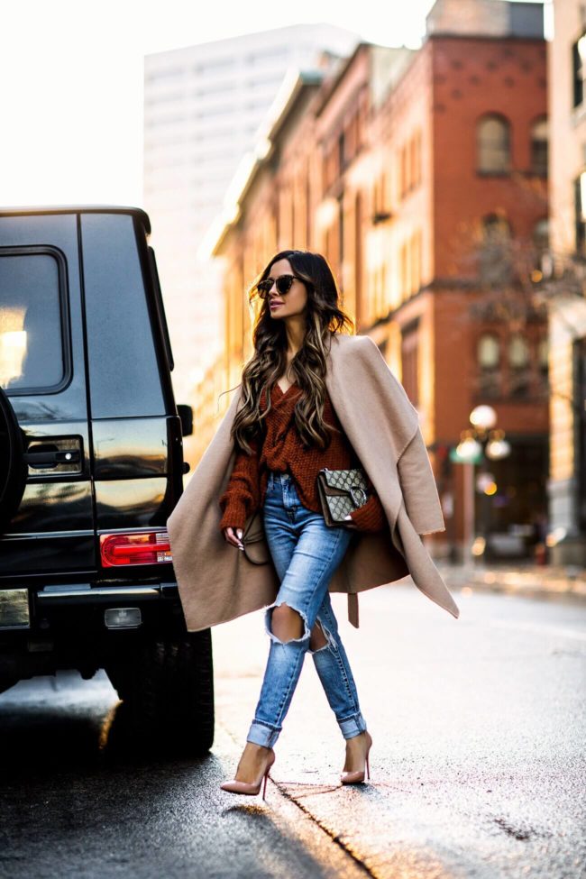 fashion blogger mia mia mine wearing a camel coat and levi's jeans from shopbop