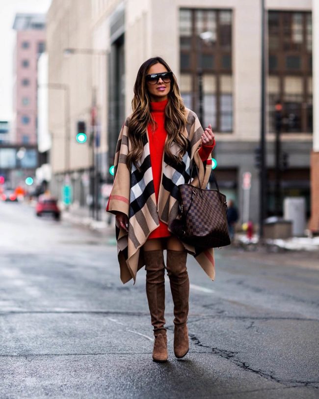 mia mia mine wearing a burberry cape and stuart weitzman over-the-knee boots