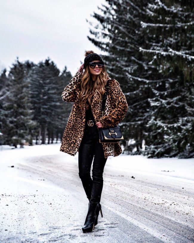 fashion blogger mia mia mine wearing a leopard coat and gucci belt