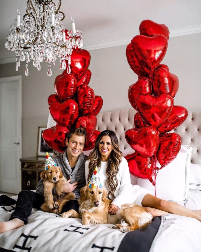 mia mia mine with husband phil thompson and golden retriever puppies