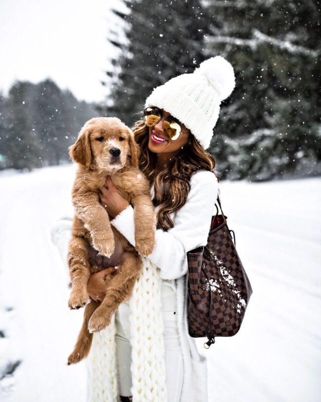 mia mia mine wearing a white beanie hat with puppy