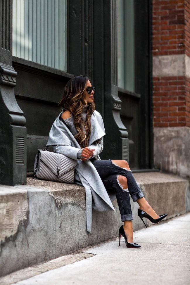 fashion blogger mia mia mine wearing a gray college bag and black louboutin heels
