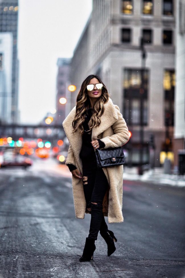 fashion blogger mia mia mine wearing a teddy bear coat and chanel bag