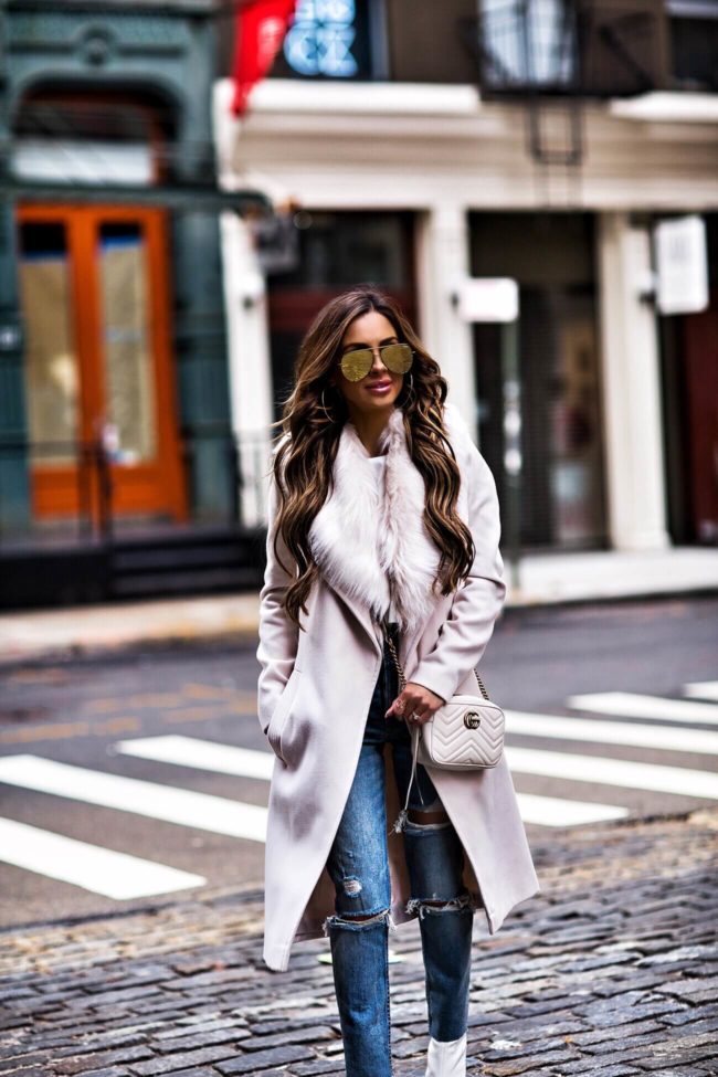 mia mia mine wearing a faux fur collar coat and grlfrnd denim from revolve