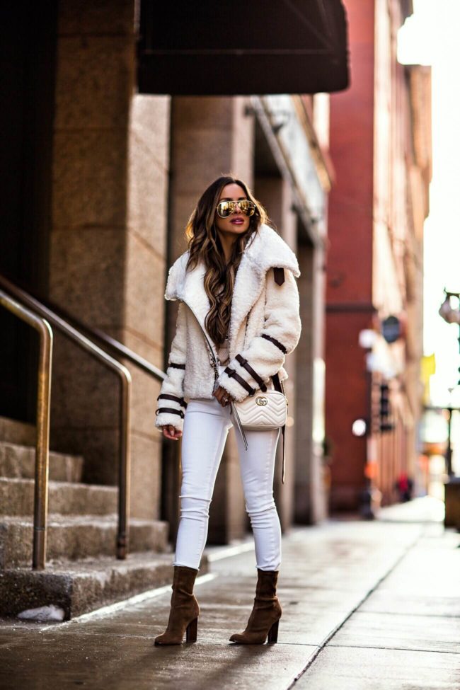 fashion blogger mia mia mine wearing a white eaves jacket and brown suede booties by alexander wang