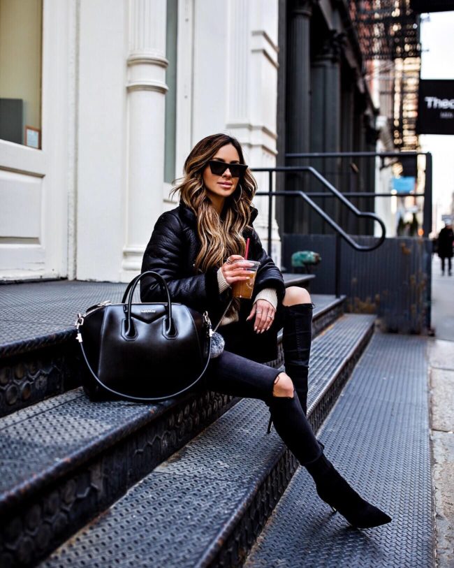 mia mia mine wearing a biker jacket and black booties at NYFW