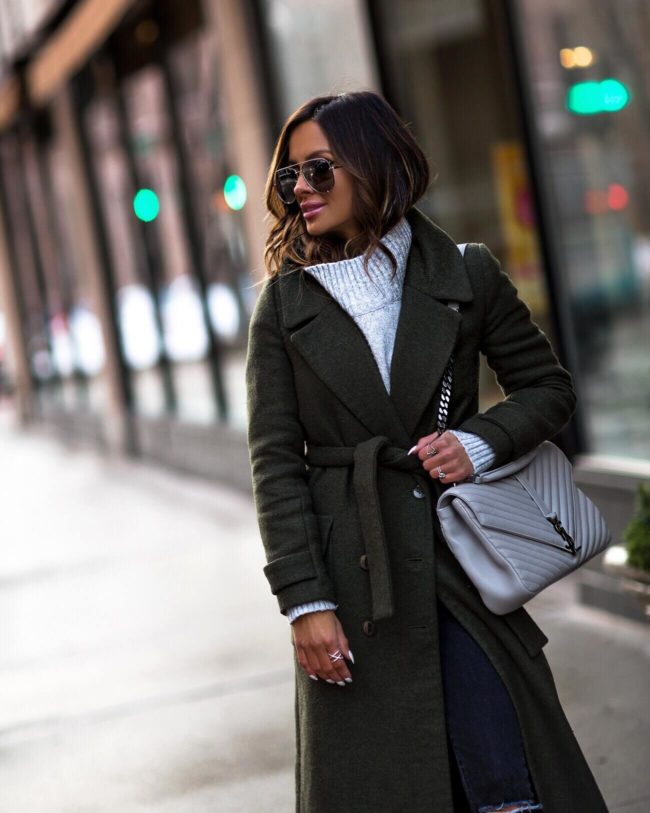 mia mia mine wearing a green trench coat and gray ysl bag