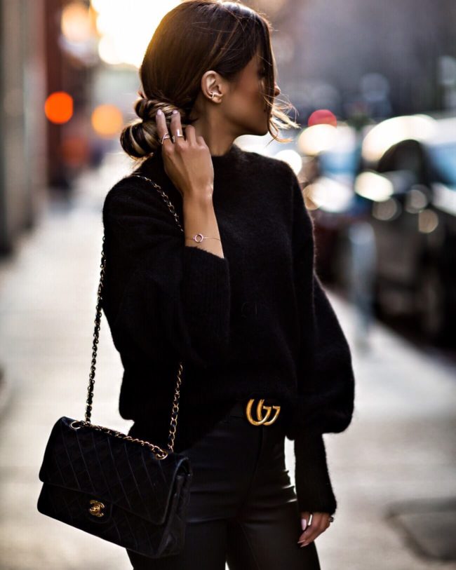 fashion blogger mia mia mine wearing a black outfit with a gucci belt