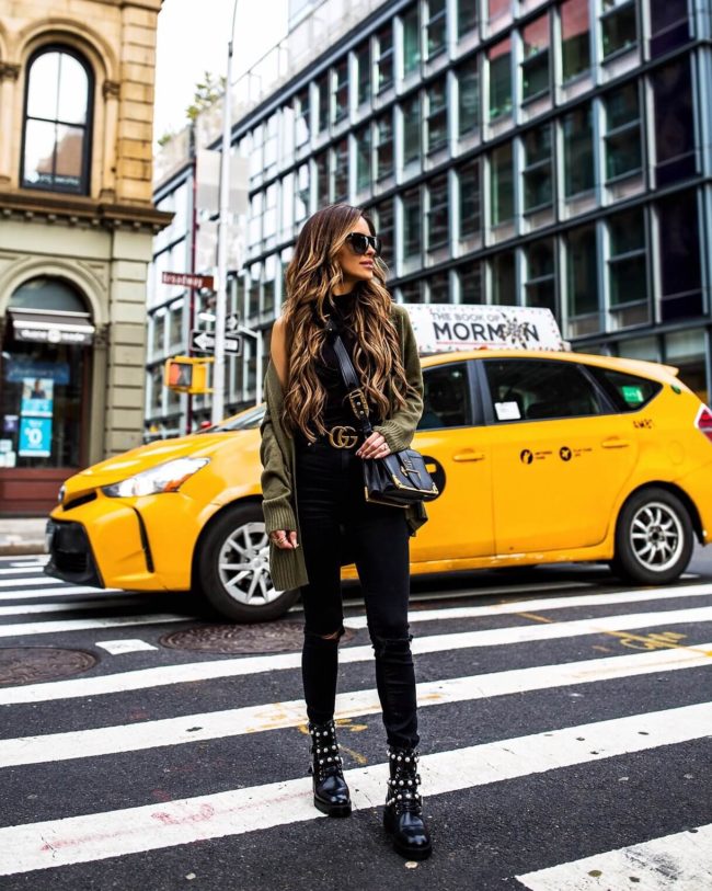 fashion blogger mia mia mine wearing a green cardigan from H&M and combat boots in NYC