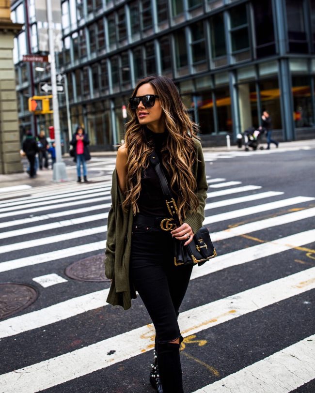 mia mia mine wearing an olive cardigan and gucci belt