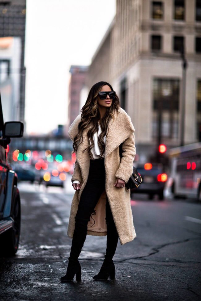 fashion blogger mia mia mine wearing a teddy bear coat from missguided