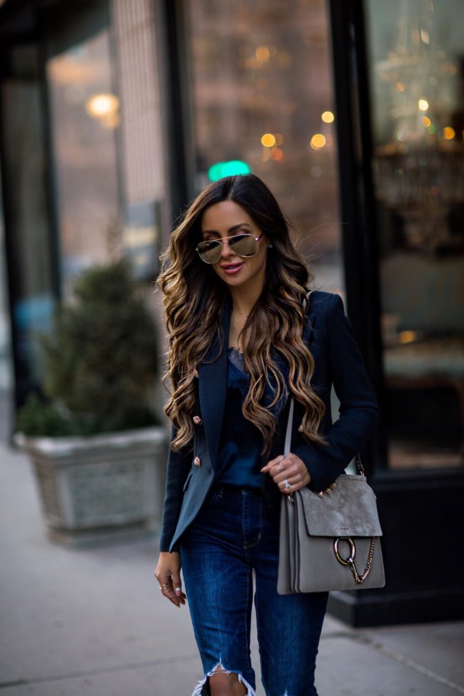 fashion blogger mia mia mine wearing a navy blazer and a chloe faye medium bag