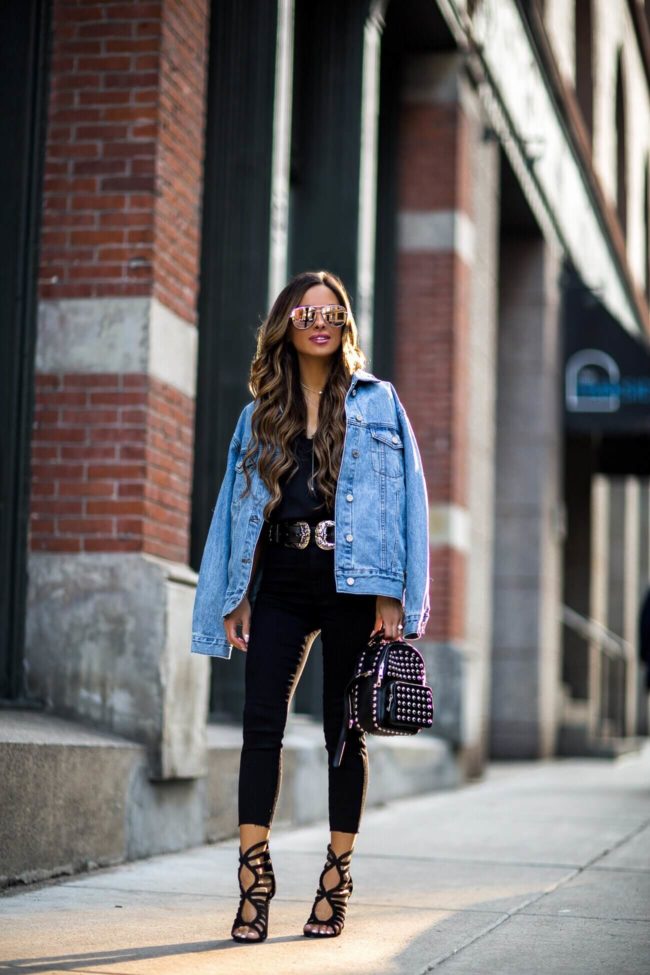 fashion blogger mia mia mine wearing a double-buckle belt and statement heels from missguided