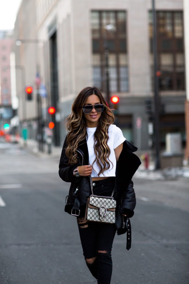 fashion blogger mia mia mine wearing a gucci dionysus bag and a white crop top