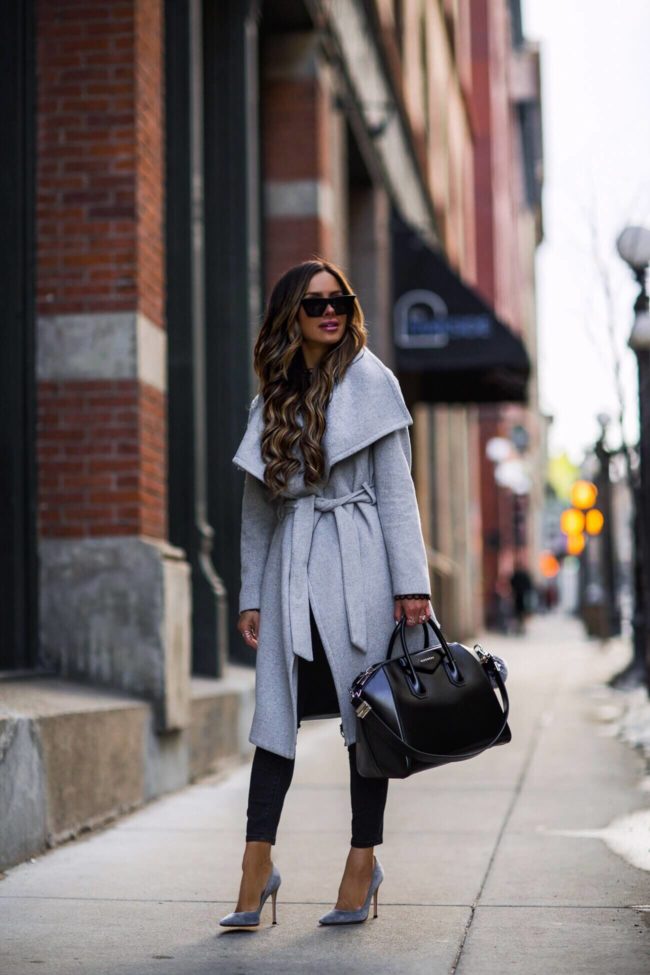 fashion blogger mia mia mine wearing a gray statement coat and a givenchy antigona bag
