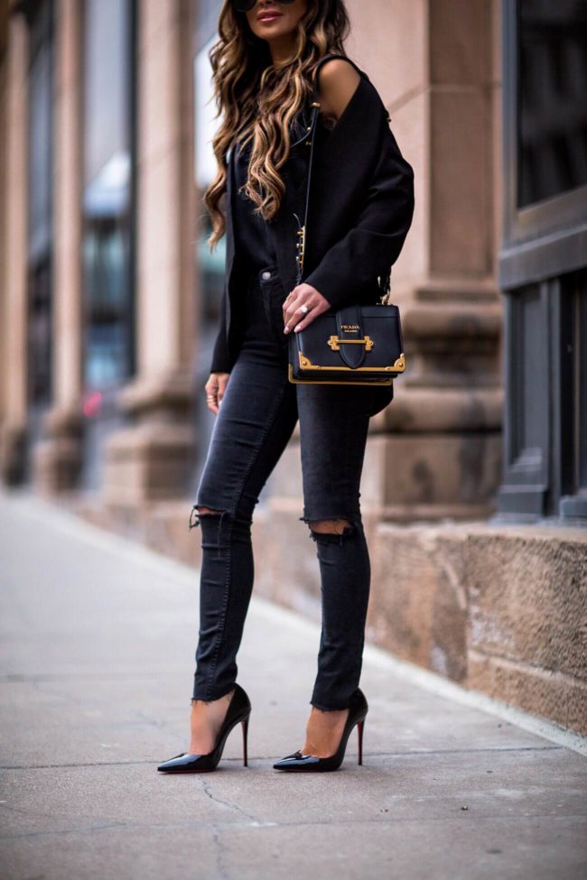 fashion blogger mia mia mine wearing grlfrnd black skinny jeans from revolve