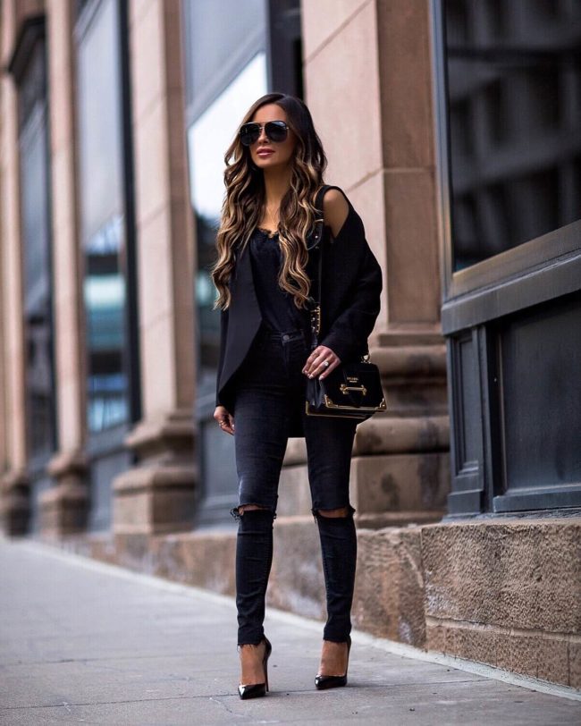 fashion blogger mia mia mine wearing a black blazer and black denim from revolve