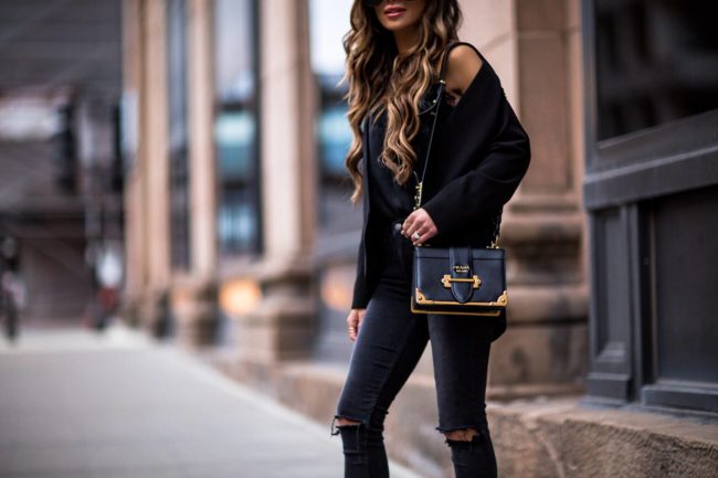 fashion blogger mia mia mine wearing a prada cahier bag and GRLFRND Black skinny jeans from revovle