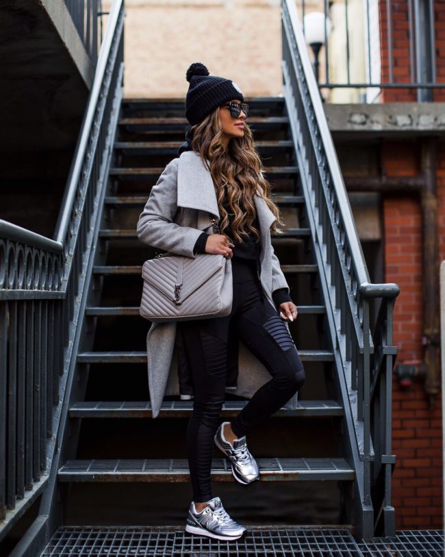 fashion blogger mia mia mine wearing a gray coat and alo yoga workout clothing