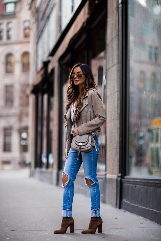 fashion blogger mia mia mine wearing a suede blank nyc jacket and levi's jeans from bloomingdale's