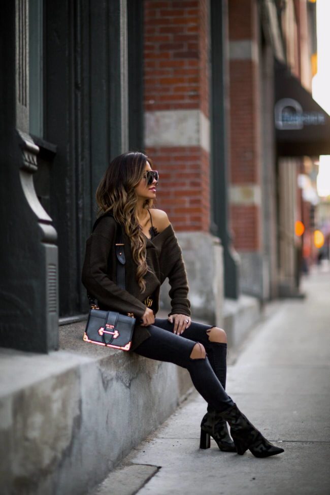fashion blogger mia mia mine wearing camo booties from nordstrom and a prada cahier bag