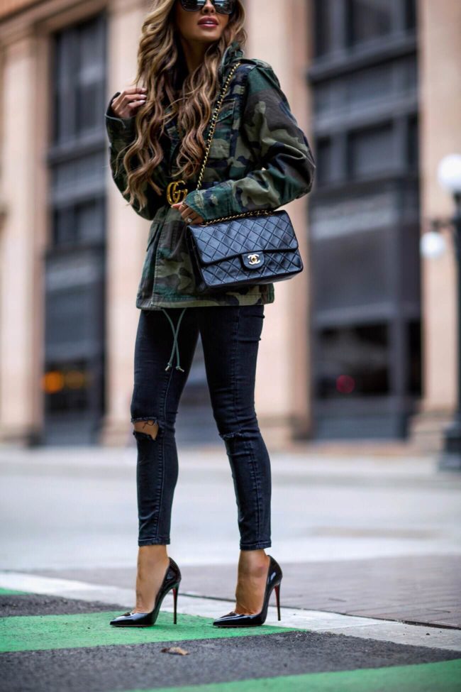 fashion blogger mia mia mine wearing a camo alpha industries jacket from shopbop and a gucci belt