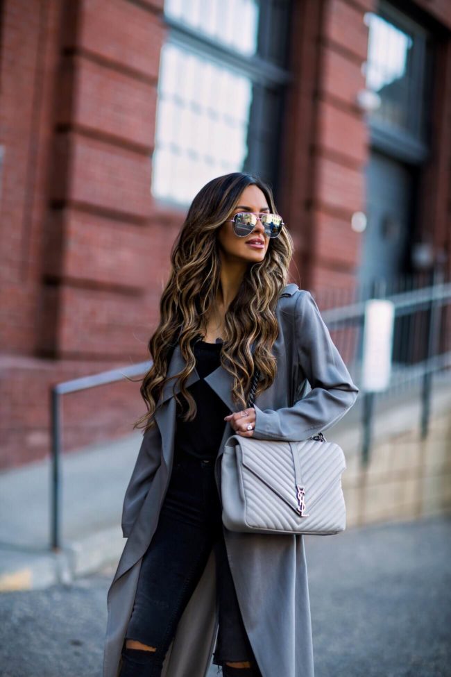fashion blogger mia mia mine wearing a gray trench coat and a saint laurent college bag