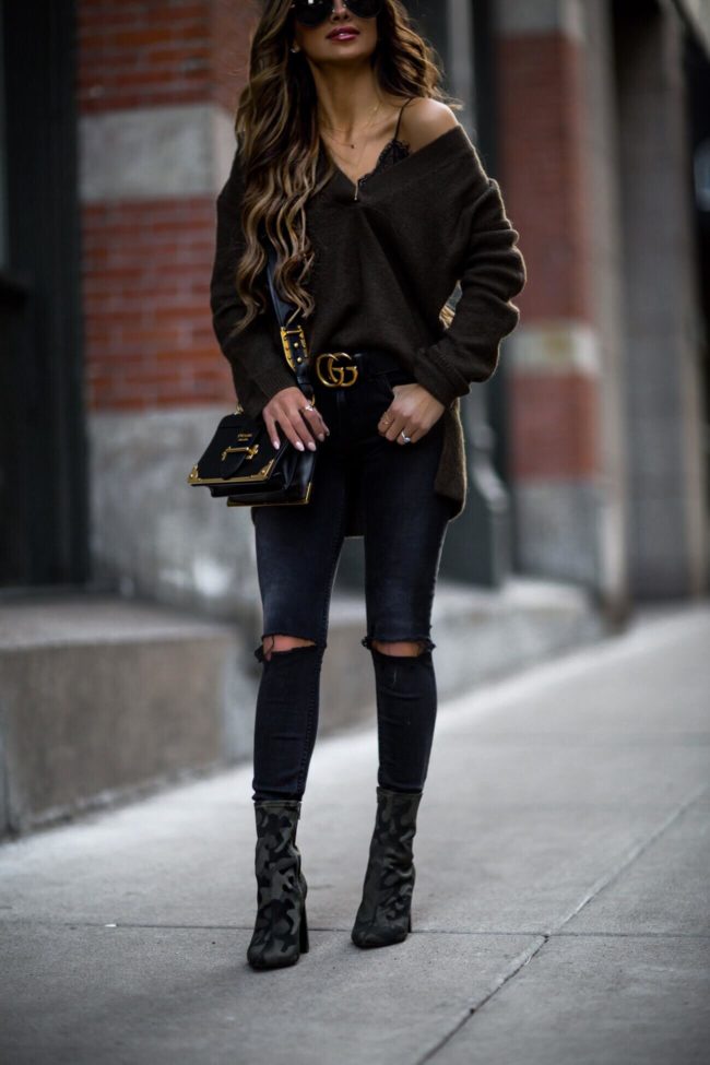 fashion blogger mia mia mine wearing black denim from revolve and a prada cahier bag