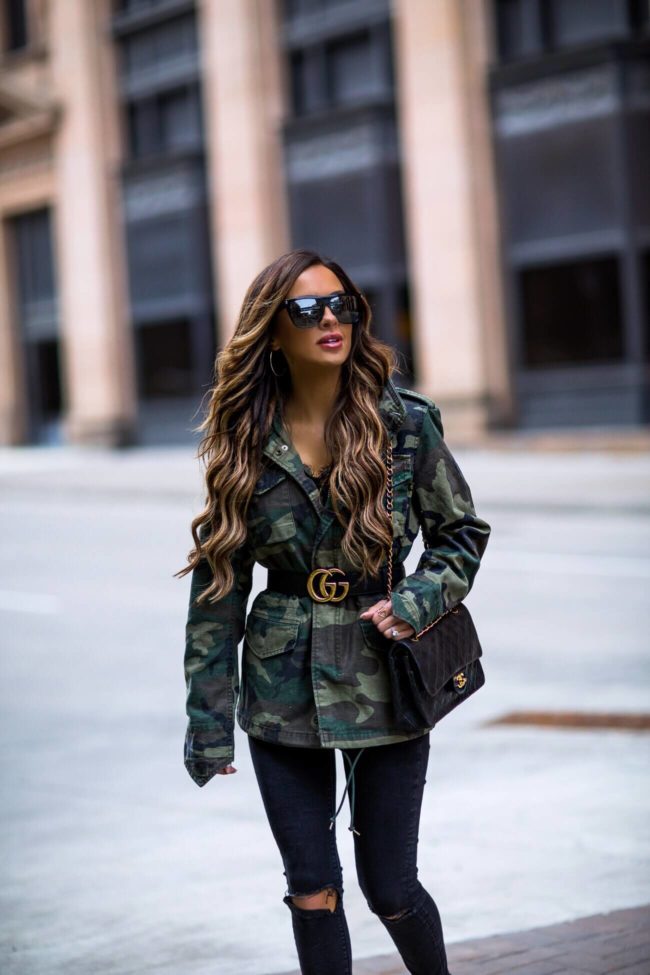 fashion blogger mia mia mine wearing a camo jacket from shopbnop and a gucci belt