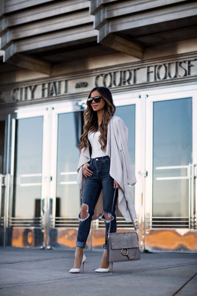 fashion blogger mia mia mine wearing gray ripped denim from levi's and white christian louboutin heels