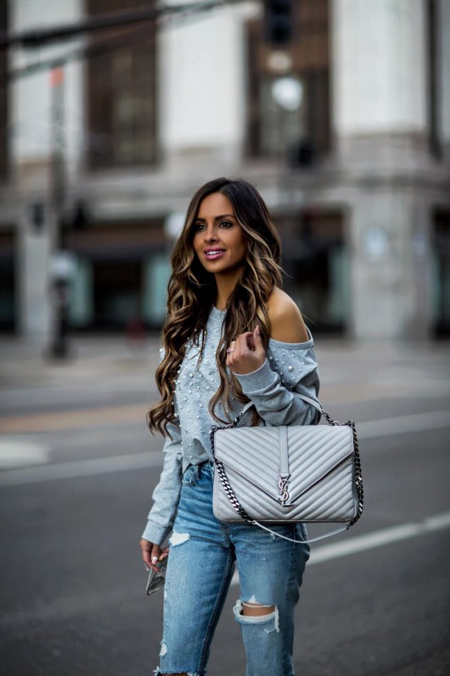 fashion blogger mia mia mine wearing an olivia culpo sweatshirt by marled x revolve