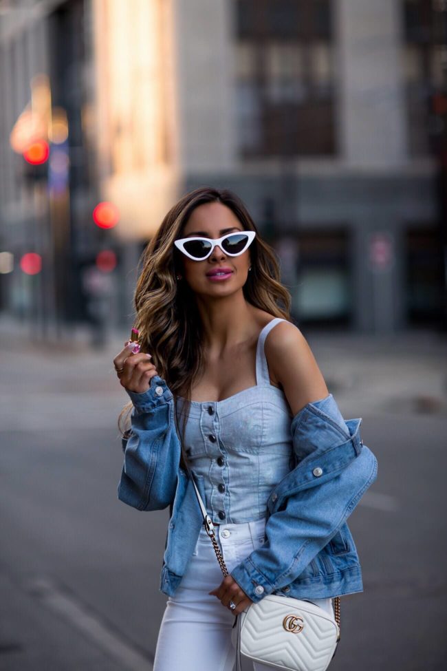 fashion blogger mia mia mine wearing a denim crop top and denim jacket from nordstrom