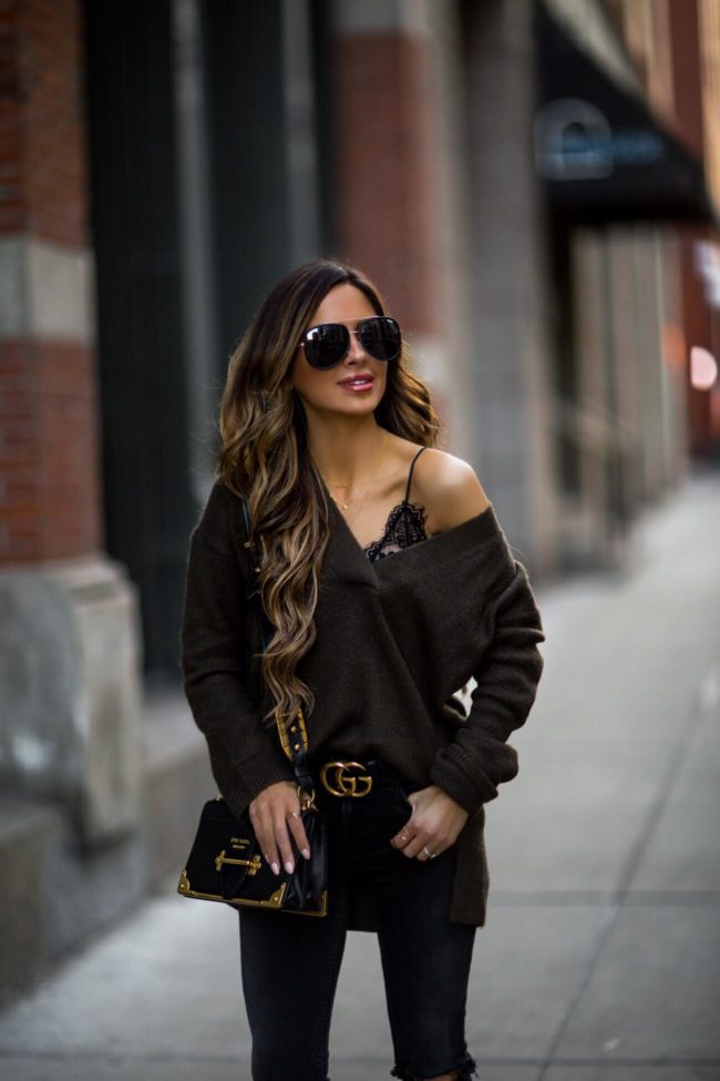 fashion blogger mia mia mine wearing a lace bralette and a prada cahier bag