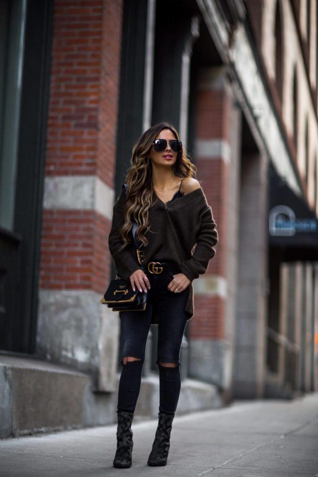 fashion blogger mia mia mine wearing a prada cahier bag and a gucci belt