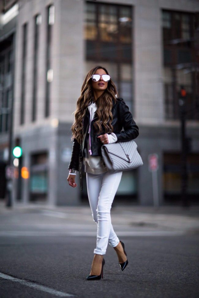 fashion blogger mia mia mine wearing a leather jacket over a white sweatshirt from H&M