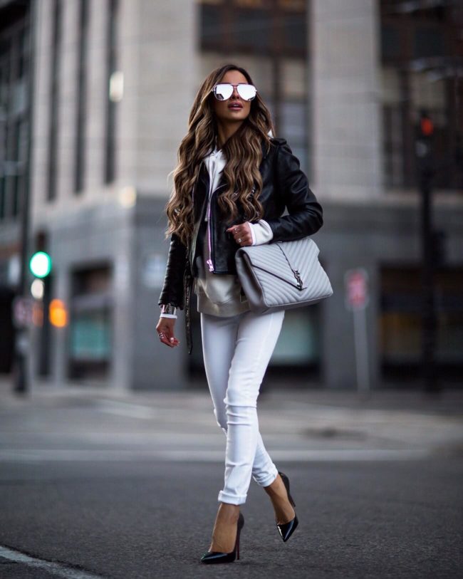 mia mia mine wearing a sweatshirt and a leather jacket