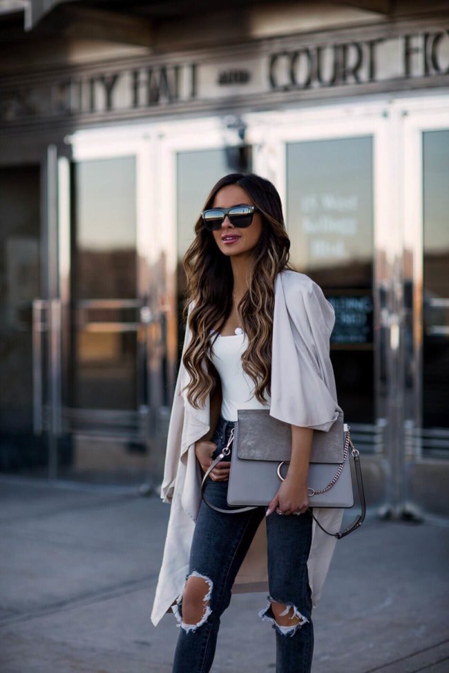 fashion blogger mia mia mine wearing a beige trench coat by cupcakes and cashmere and a chloe faye bag