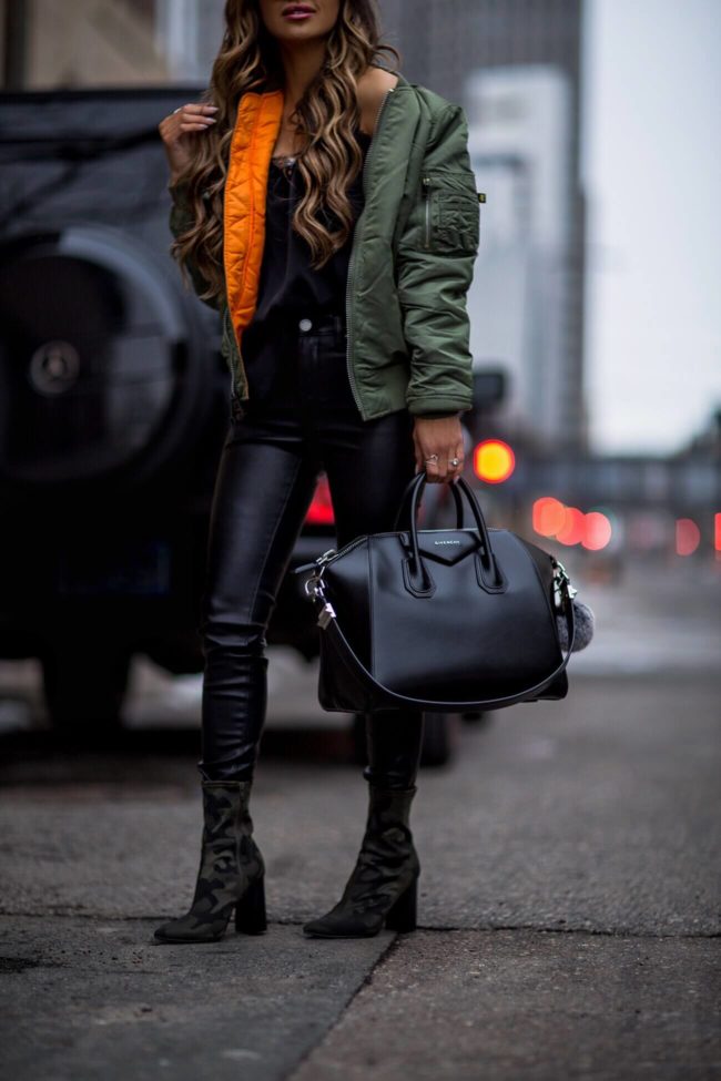 fashion blogger mia mia mine wearing an alpha industries bomber jacket and camo booties 