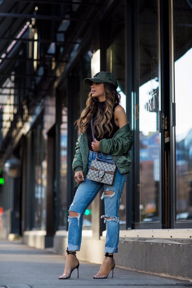 fashion blogger mia mia mine wearing jimmy choo heels and a gucci dionysus bag