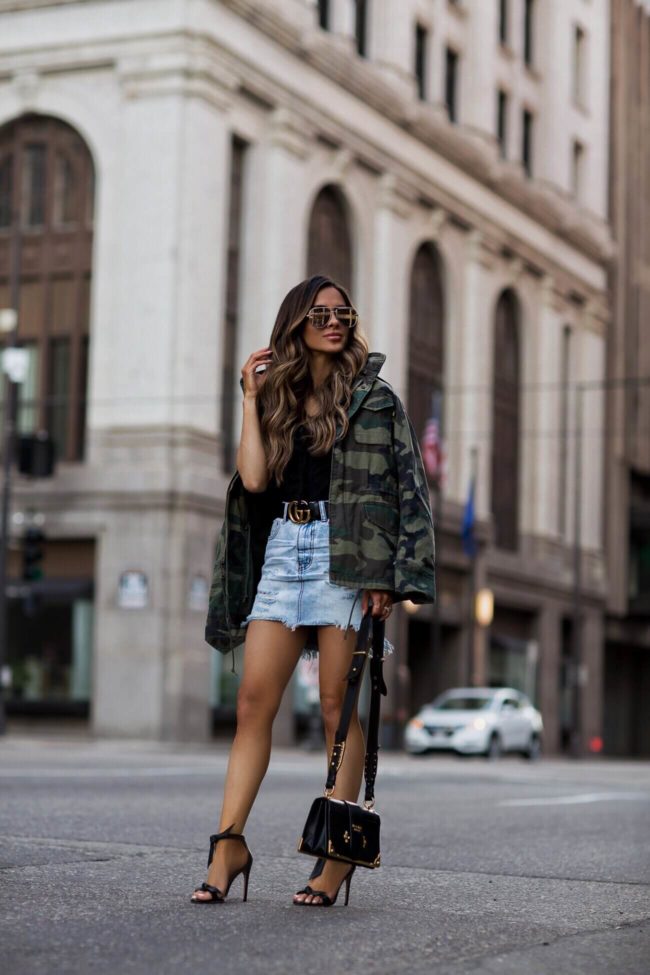 fashion blogger mia mia mine wearing an alpha industries camo jacket and a one teaspoon denim skirt from shopbop