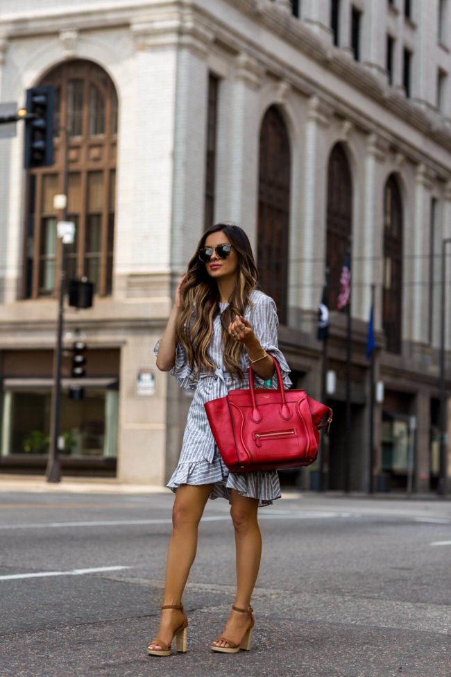 fashion blogger mia mia mine wearing a blue and white dress from macy's for summer 2018