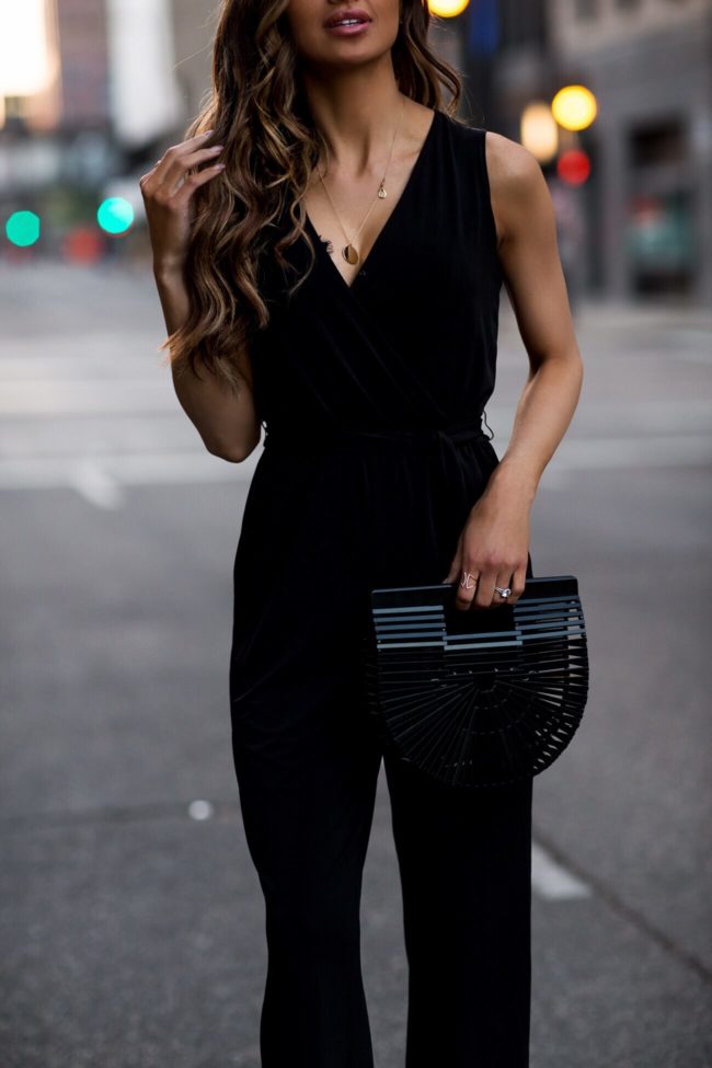 fashion blogger mia mia mine wearing a black jumpsuit for summer