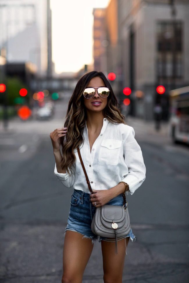 fashion blogger mia mia mine wearing a white button-down shirt from macy's