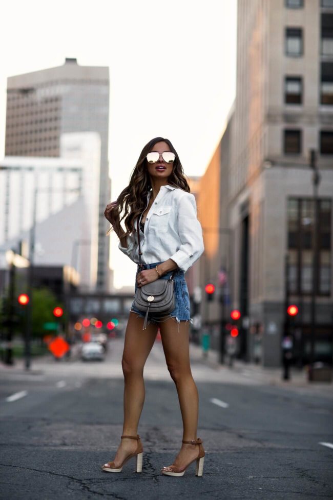 fashion blogger mia mia mine wearing a white linen button-down shirt from macy's