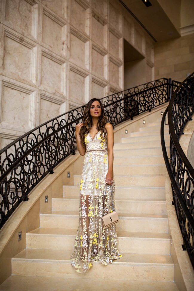 fashion blogger mia mia mine wearing a yellow embroidered maxi dress from bloomingdale's