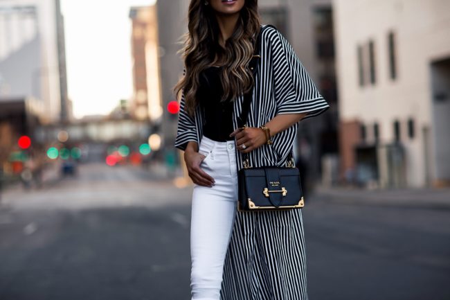 fashion blogger mia mia mine wearing a prada cahier bag and a striped kimono jacket