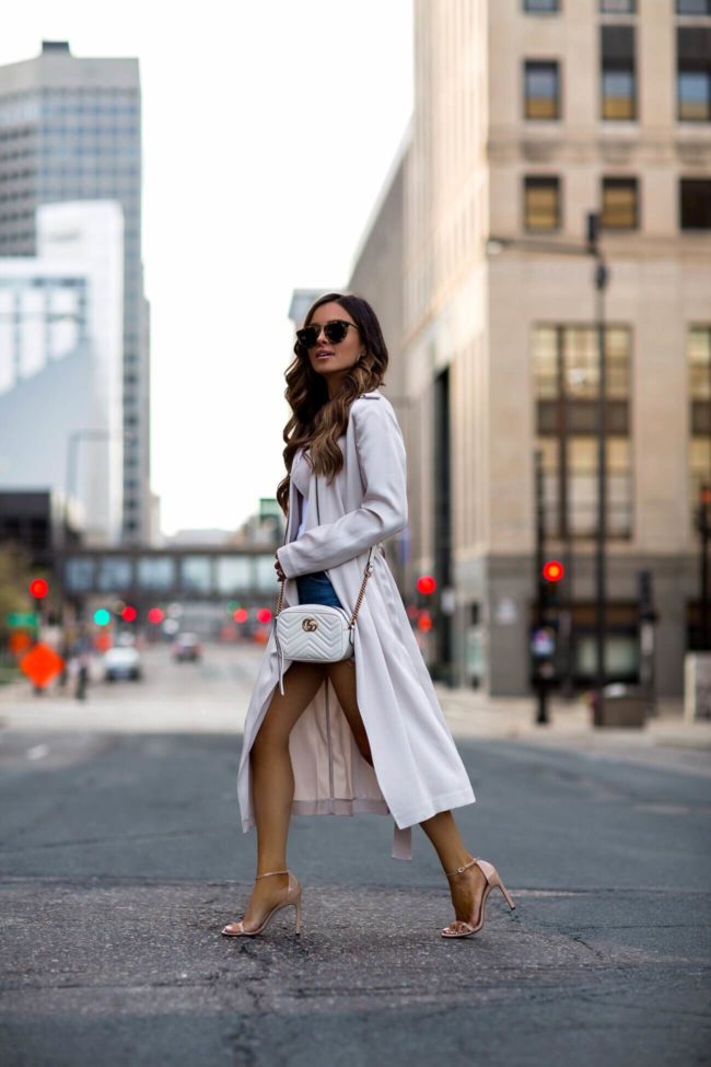 fashion blogger mia mia mine wearing a gucci marmont white mini crossbody bag