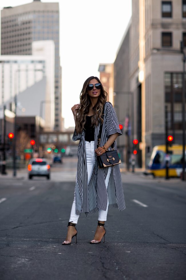 fashion blogger mia mia mine wearing a striped cover-up and manolo blahnik estro heels