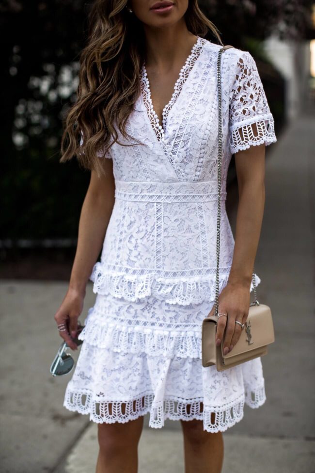 fashion blogger mia mia mine wearing a saint laurent sunset bag and a white lace french connection dress